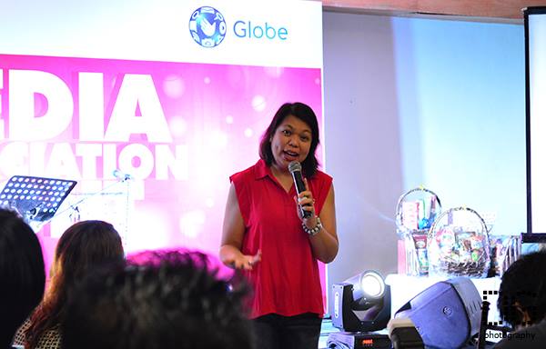Ms. Yolanda Crisanto of Globe Corporate Communications giving updates to the media.
